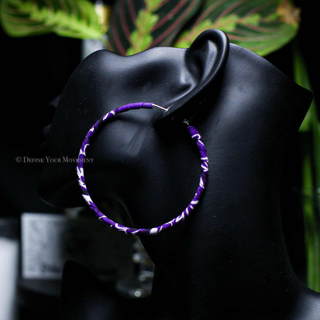 Transform your look with our Thin Purple Bandana Hoop Earrings! Featuring vibrant fabric and a lightweight design, these earrings are sure to add a playful touch to any outfit. Comfortable for all-day wear, they'll quickly become your go-to accessory.